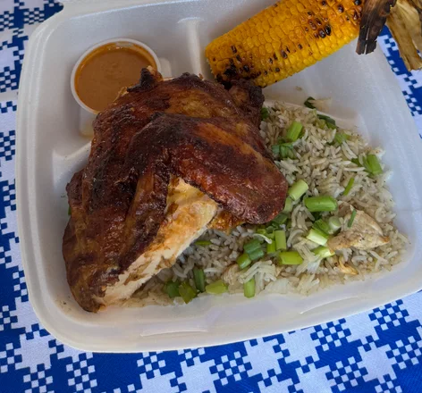 The Chicoco plate: quarter chicken, fried rice with green onion, grilled elote and a cup of salsa